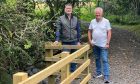 Athole McDonald and Craigie Hill Golf Club’s past captain Paul Fagan next to new fence on Buckie Braes path, Perth