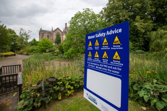 Water safety notice beside dried out pond at Norie-MIller walk, Perth