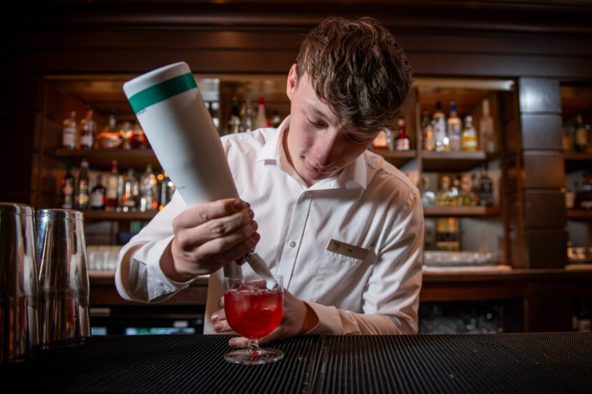 Bartender Olly crafting a cocktail at Fairmont St Andrews.