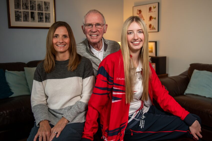 Special Olympian Dundee swimmer Taylor MacKenzie with mum Lisa and dad Richard.