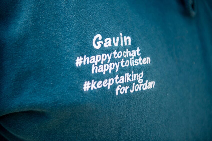 Close up of sewatshirt with logo 'Gavin #happy to chat happy to listen #keep talking for Jordan'