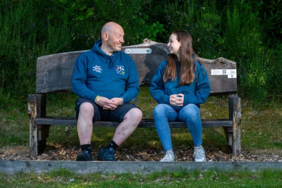 Gavin Hart and Joselyn Turner seated on oak bench in Blairgowrie