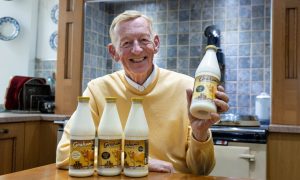 Robert Graham with a bottle of Gold Top Milk at the family Dairy in Bridge of Allan near Stirling.