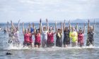 Fiona Livingstone Fitness take part in an attempt on the world record for the most people dipping in the sea holding hands. In aid of charity Megan's Space, a suicide charity set up by her parents, Rob and Jenny Copeland, from Ayrshire, after their daughter's death in 2019 aged 20. Supplied by Tina Norris