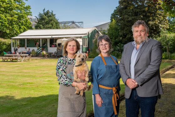 Flower Pavilion owner Linda Cooper (and dog Liesel), Donna Grove-White, owner of Roamer Coffee Company and Montrose Port CEO Tom Hutchison at the Inch Pavilion and bowling green. Image: Supplied
