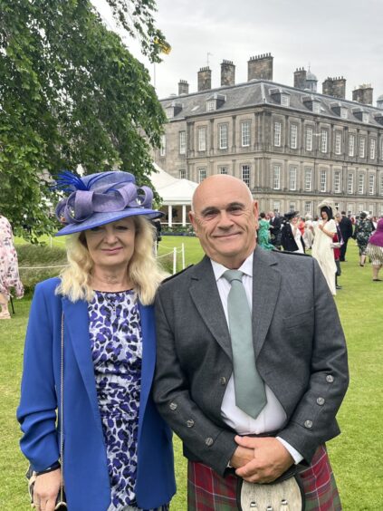 Linda and Ian Grant, smartly dressed at Holyrood royal garden party, Edinburgh