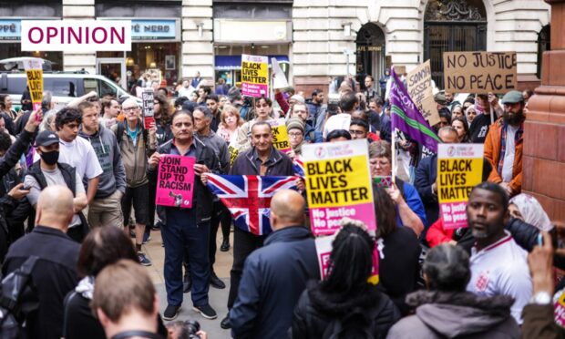 A demonstration in Manchester after an incident involving police at Manchester Airport. Image: James Speakman/PA Wire