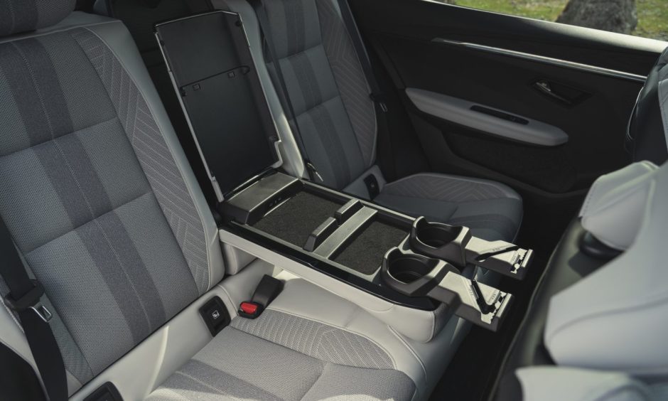 The back seats with fold down arm rest and cup holders in the Renault Scenic E-Tech