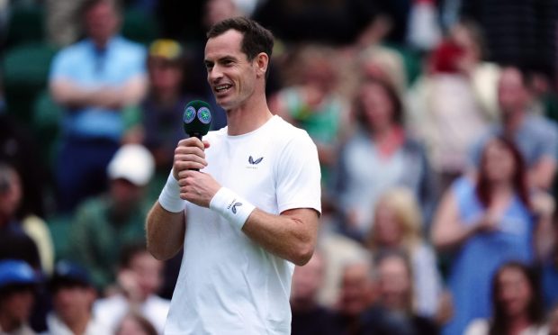 Andy Murray on centre court after centre court paid tribute to him following his gentlemen's doubles match with Jamie Murray against Rinky Hijikata and John Peers on day four of the 2024 Wimbledon Championships at the All England Lawn Tennis and Croquet Club, London. Picture date: Thursday July 4, 2024.