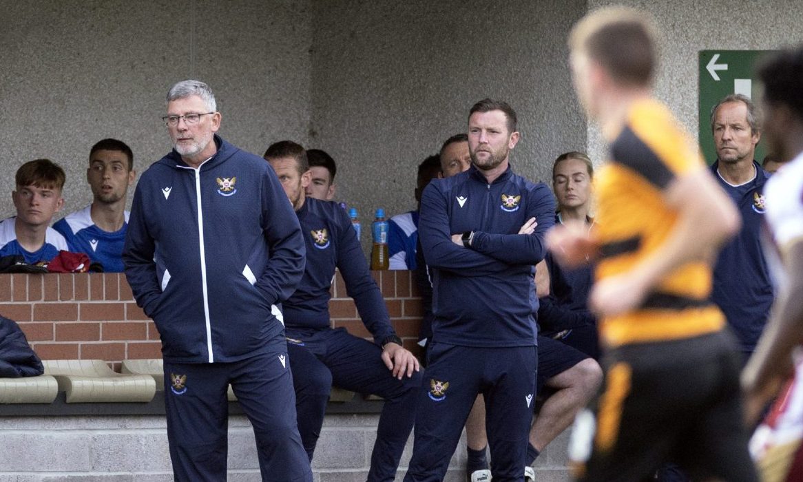 Craig Levein watches on.