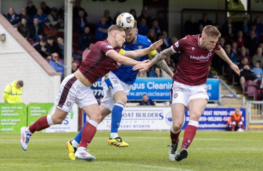 Kyle Cameron challenges for a header at Arbroath.