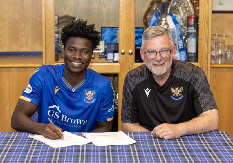 Aaron Essel pictured with manager Craig Levein after signing for St Johnstone.