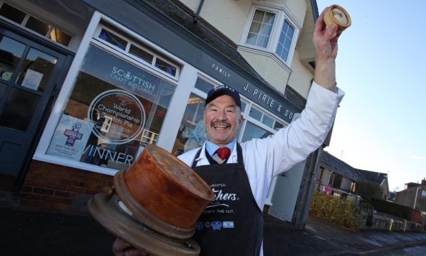 Newtyle butcher Alan Pirie outside the shop which could no be converted into flats. Image: Ron Cathro