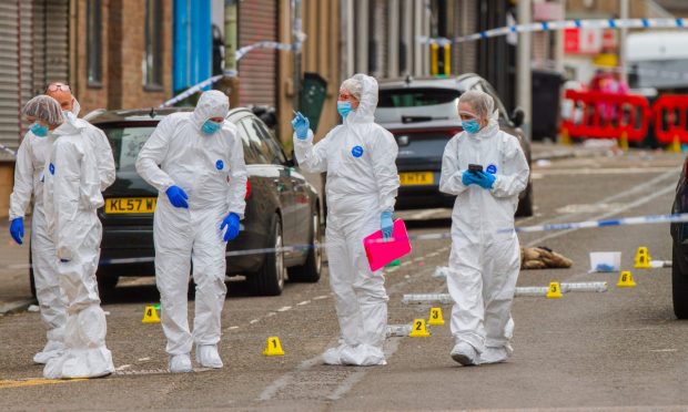 Forensics officers on Strathmartine Road in Dundee. Image: Steve MacDougall/DC Thomson