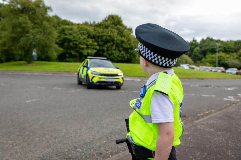 Anthony Green watching police cars at Glenrothes police station