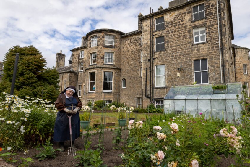 Sister Mary Agnes at work in the garden.