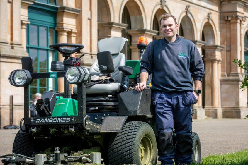 Dundee City Council gardener Nicholas uses a grass cutting machine to maintain the grounds. Image: Steve Brown/DC Thomson