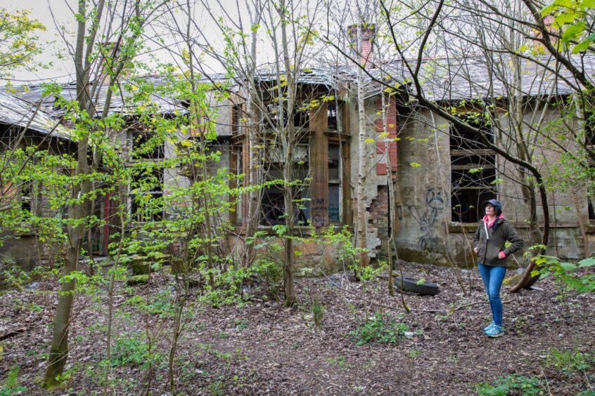 Gayle explores abandoned Thornton Fever Hospital in Fife. Image: Steve Brown. 