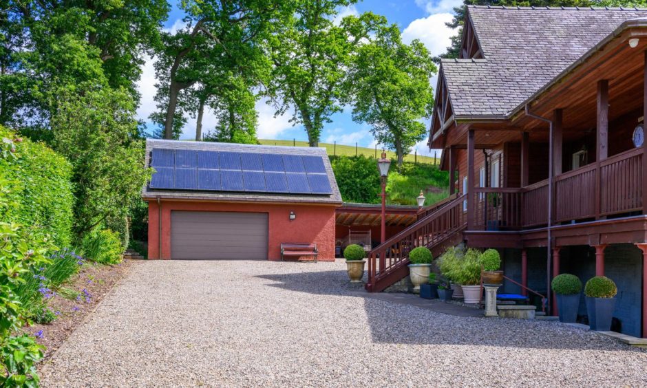 A large garage at Sunfield House has solar panels.