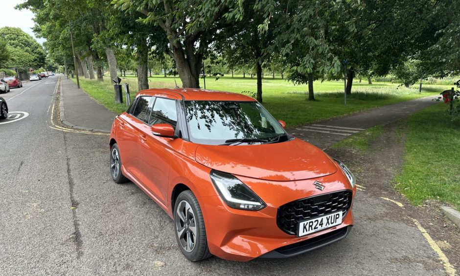 The Swift parked up at Dundee's Magdalen Green, with trees and grass in the background