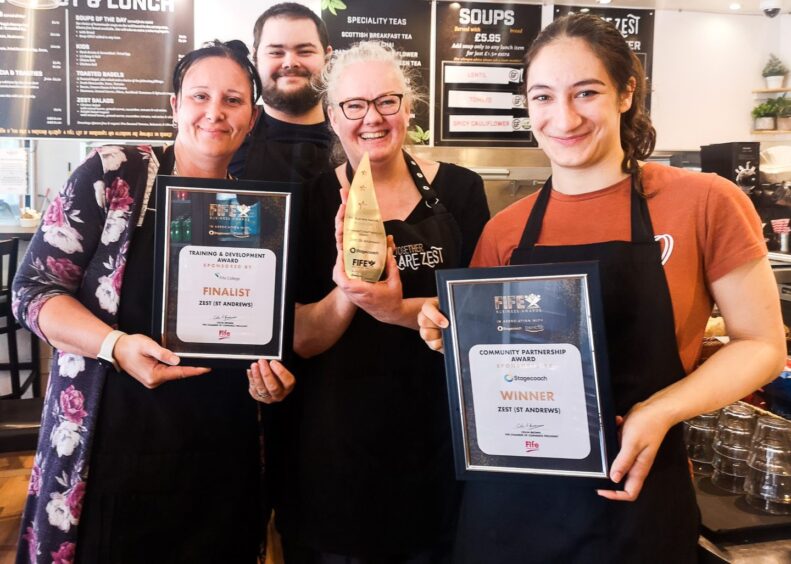 Lisa (centre) and some of the We Are Zest team with their Fife Business Award for Best Community Partnership and Finalist certificate for the Training and Development award. 