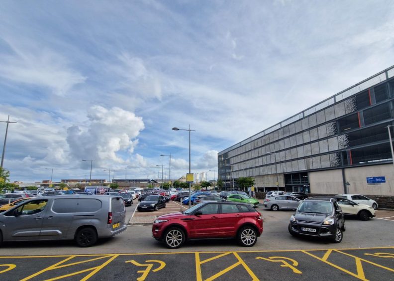 Cars queuing to exit the retail park.