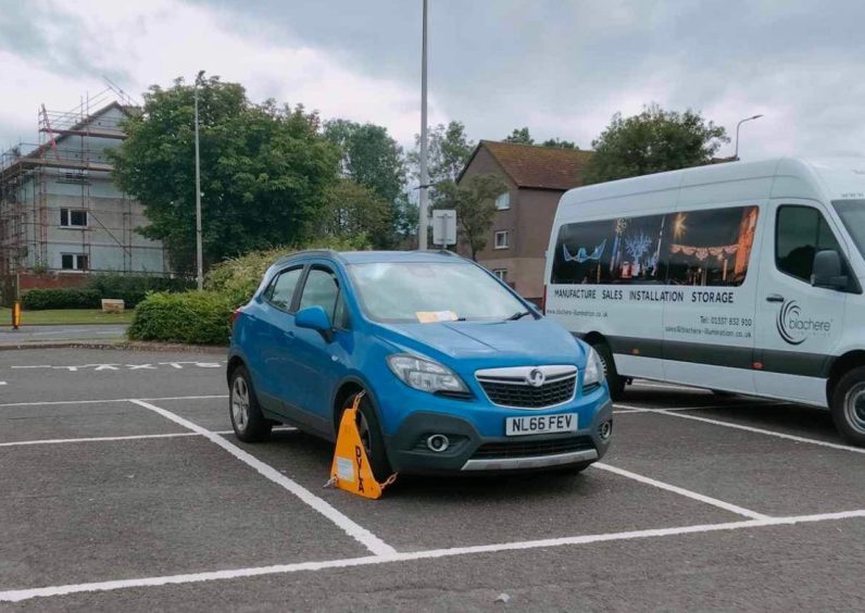 A clamped car in Glenrothes as part of the latest DVLA crackdown in Fife