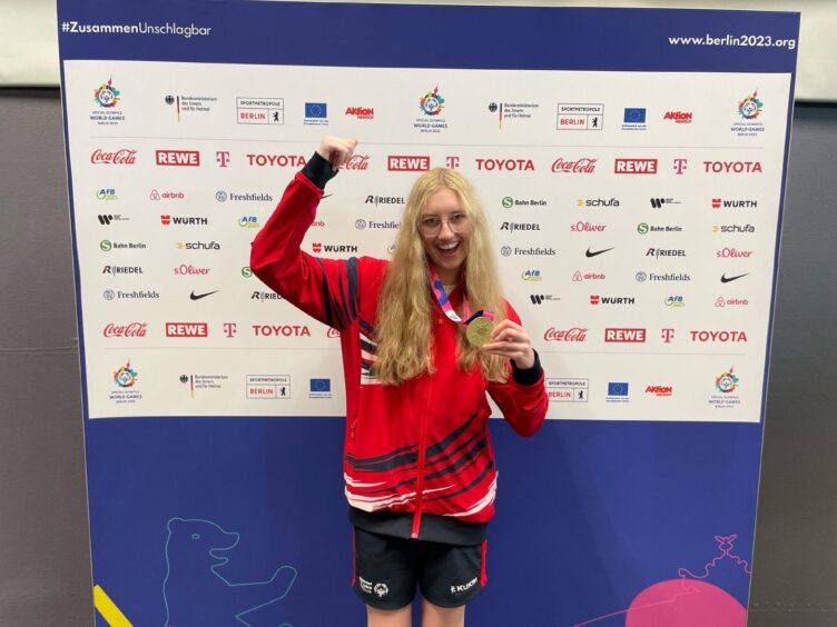 Taylor with her medals at the Special Olympics in Berlin. 