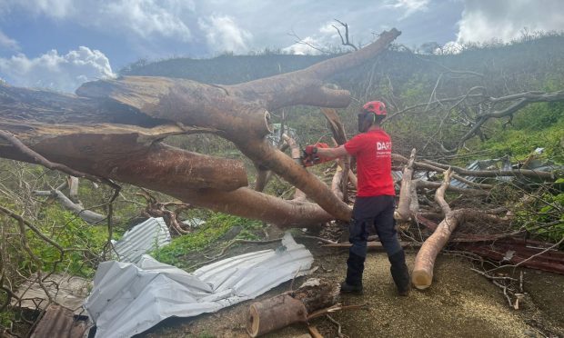 Owen Jamieson working to clear the devastation on the Caribbean island of Carriacou. Image: DART