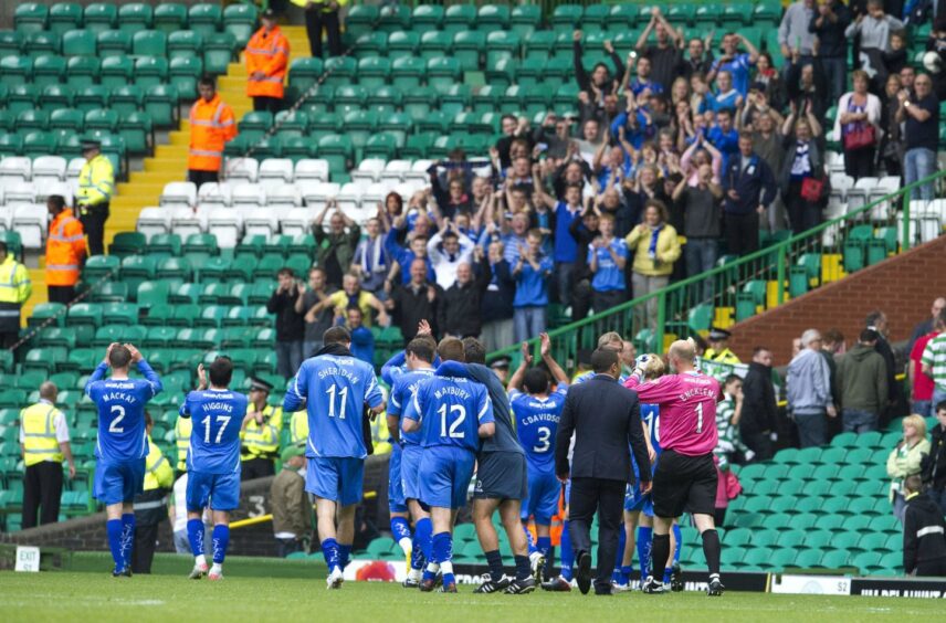 A small group of St Johnstone fans celebrate after seeing their team win at Celtic Park in 2011. 