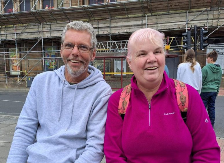 Alan MacInnes and Fiona Clark smiling on Crieff High Street