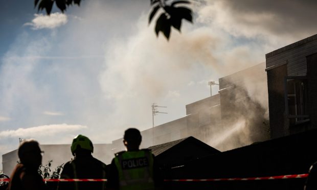 Smoke rising from the house on Linfield Street.