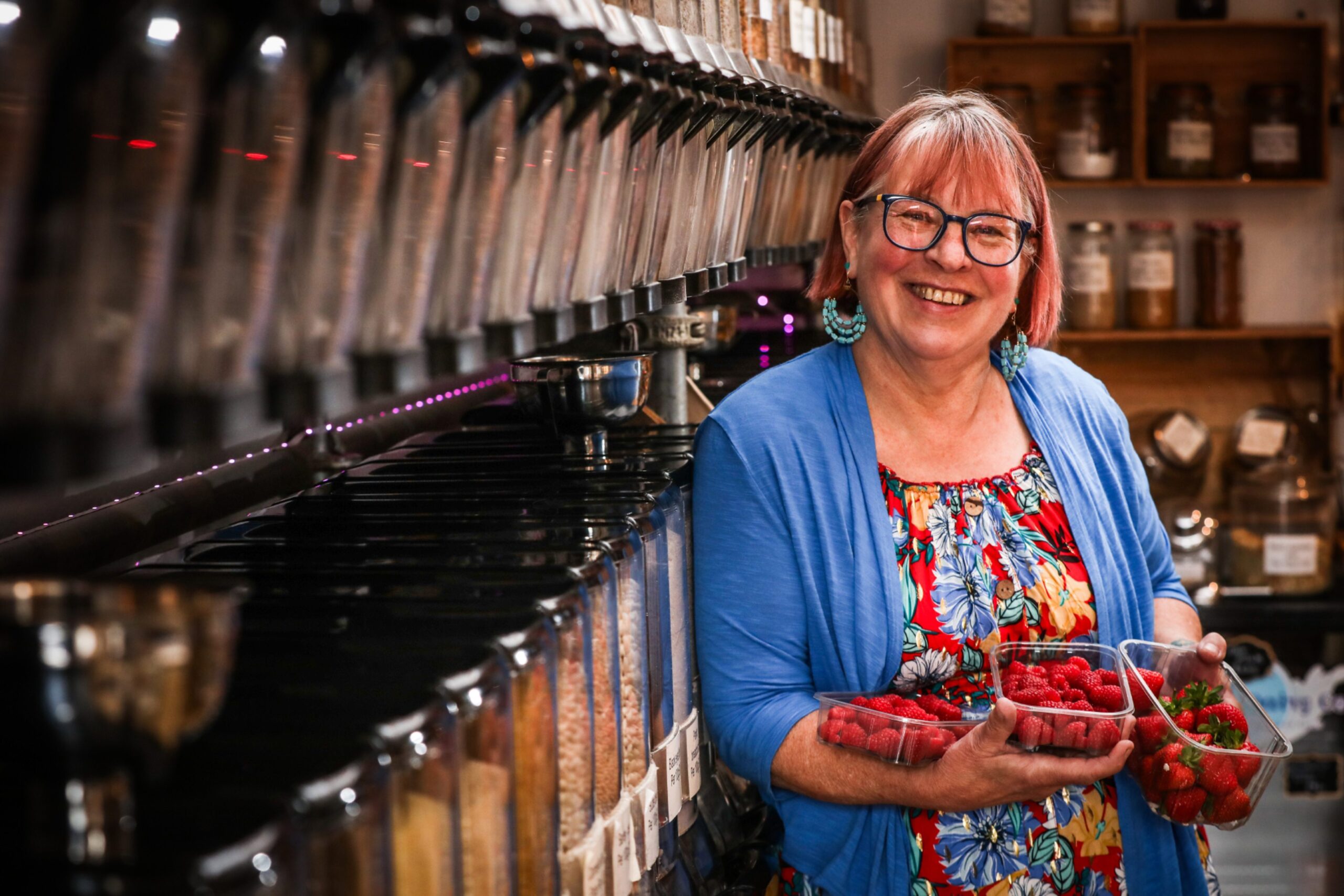 Melanie Coleman holding berries in Love Your Planet Broughty Ferry.