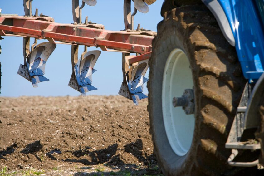 Plough on tractor