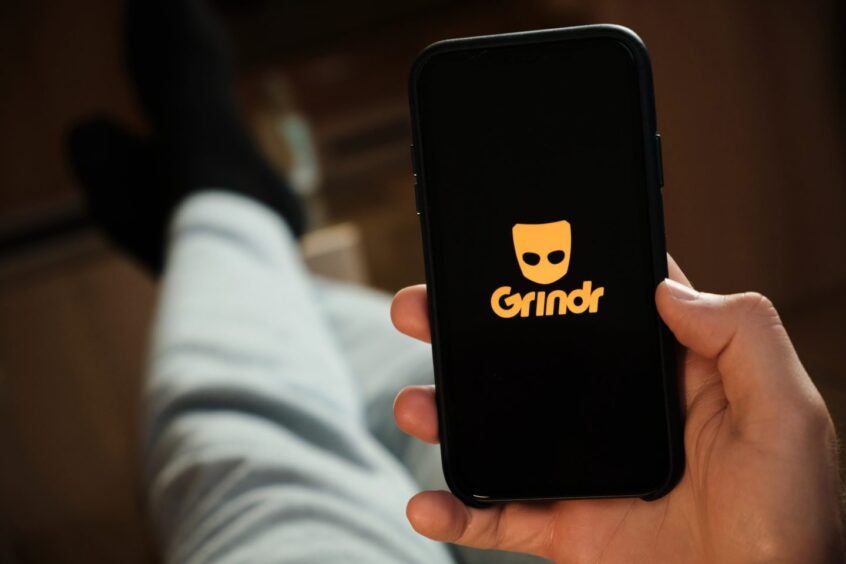 Grindr logo on phone