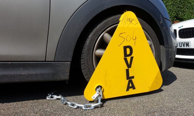Cars have been clamped by the DVLA. Image: Shutterstock