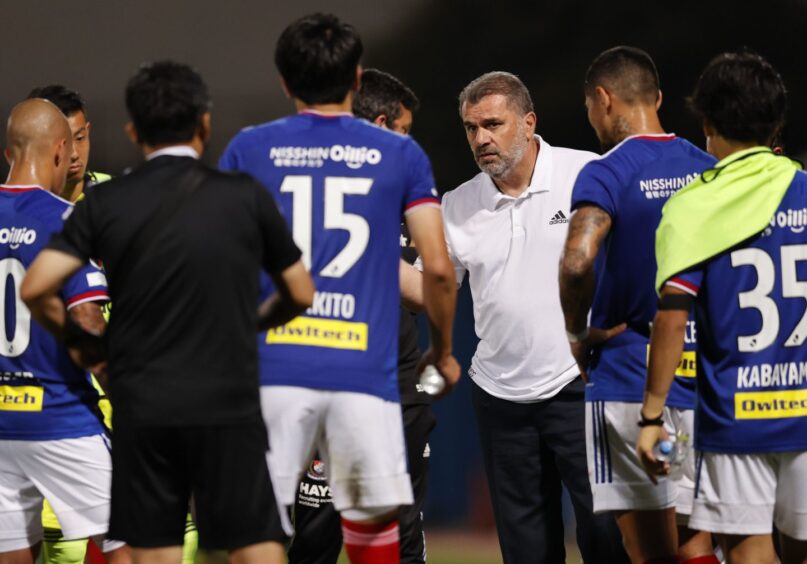 Ange Postecoglou addresses his players during his time in charge of Yokohama F Marinos