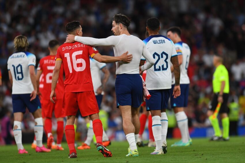 Dorian Babunski, No.16, embraces Jack Grealish