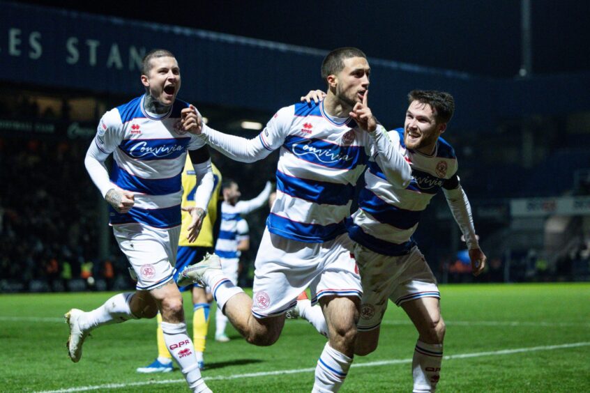 Larkeche celebrates with Scotland star Lyndon Dykes after forcing an own goal against Stoke City. Image: Ian Tuttle/Shutterstock