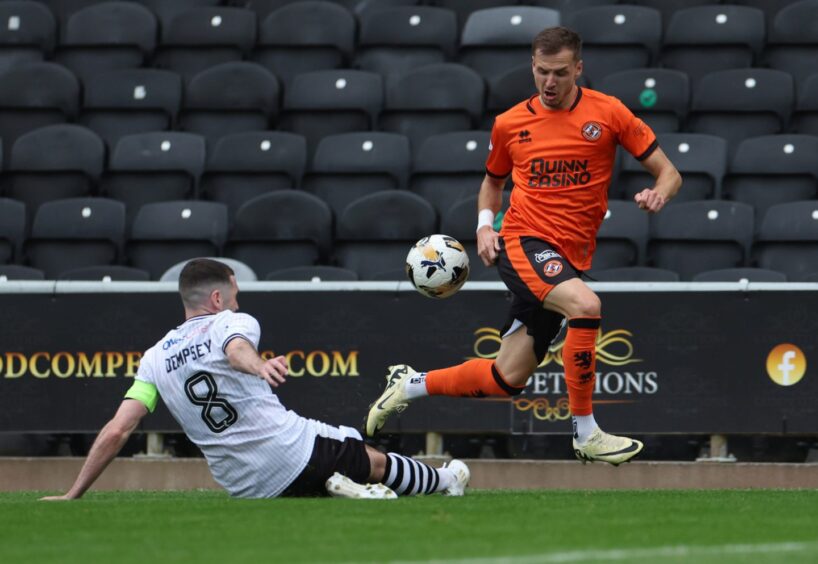 Dundee United's Kristijan Trapanovski skips away from Ayr United's Ben Dempsey