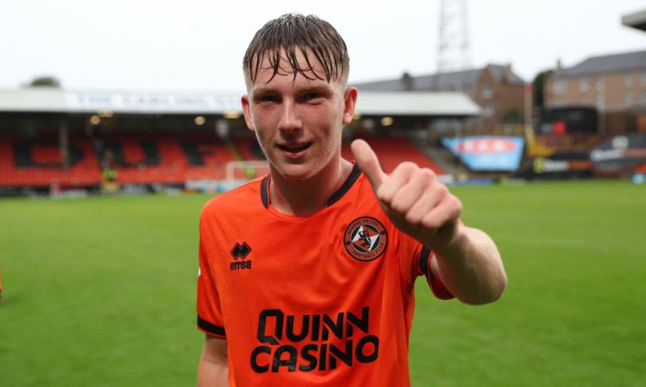 Brandon Forbes in his Dundee United kit giving a thumbs up to the camera