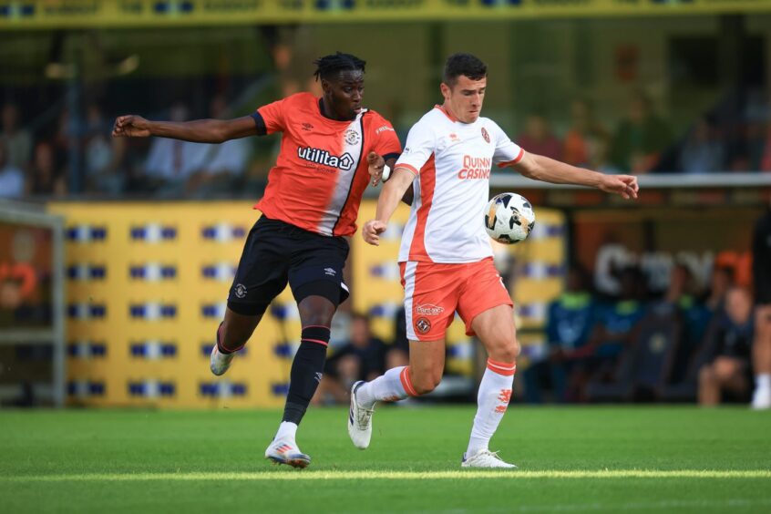 Ross Graham shrugs off the imposing Adebayo.