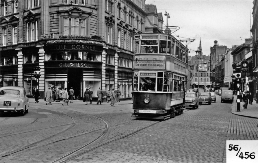 A track star goes past G.L. Wilson store in this image from Bygone Dundee 