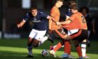 Dundee B striker Rayan Mohammed and United B defender Sean Borland battle for the ball. Image: David Young