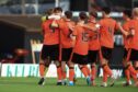 Dundee United B celebrate their penalty victory over rivals Dundee B in the SPFL Trust Trophy. Image: David Young