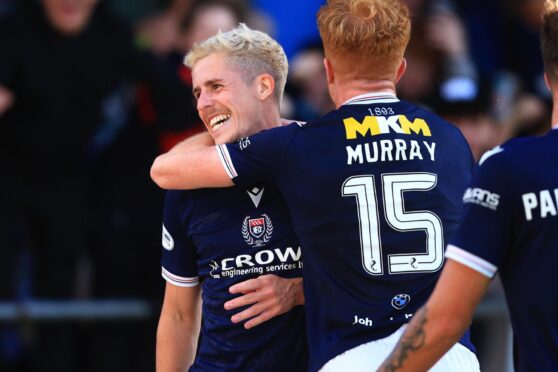 Luke McCowan and Simon Murray celebrate as Dundee go three up against Hearts. Image: David Young/Shutterstock