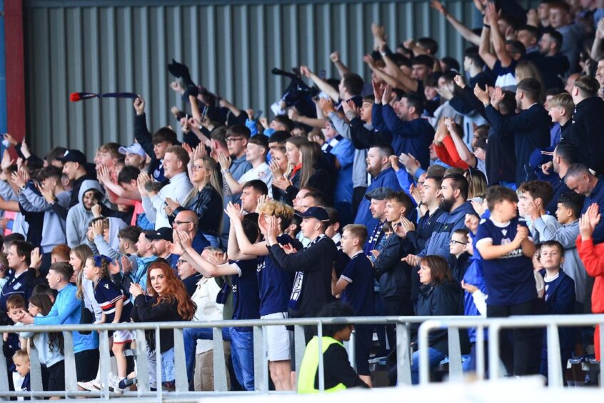 Dundee fans in the South Enclosure at Dens Park. Image: David Young/Shutterstock