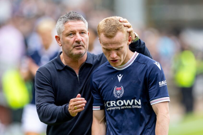 Tony Docherty with Scott Tiffoney after full-time in the derby. Image: Alan Rennie/Shutterstock