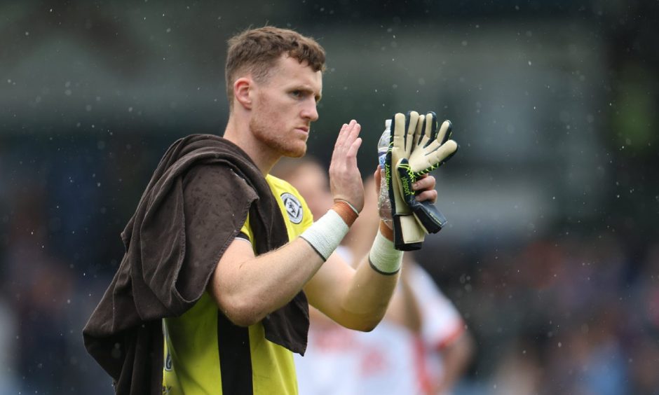 Jack Walton applauds the Dundee United faithful