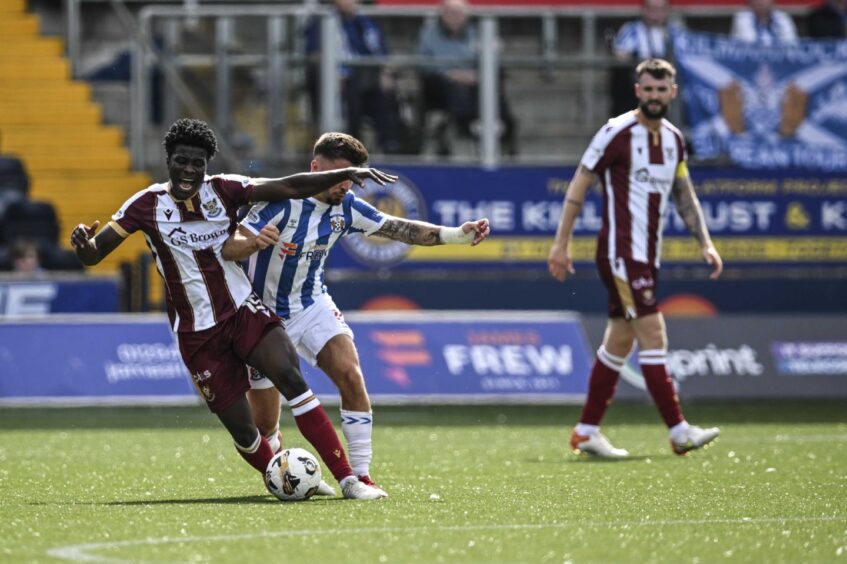 Aaron Essel wins the ball at Rugby Park.